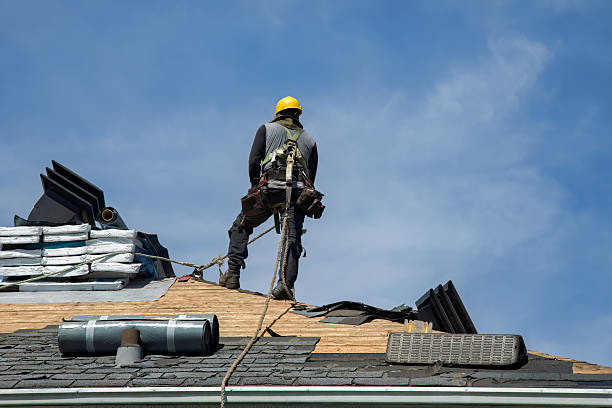 Professional Roof Replacement technician working in Plainville, MA
